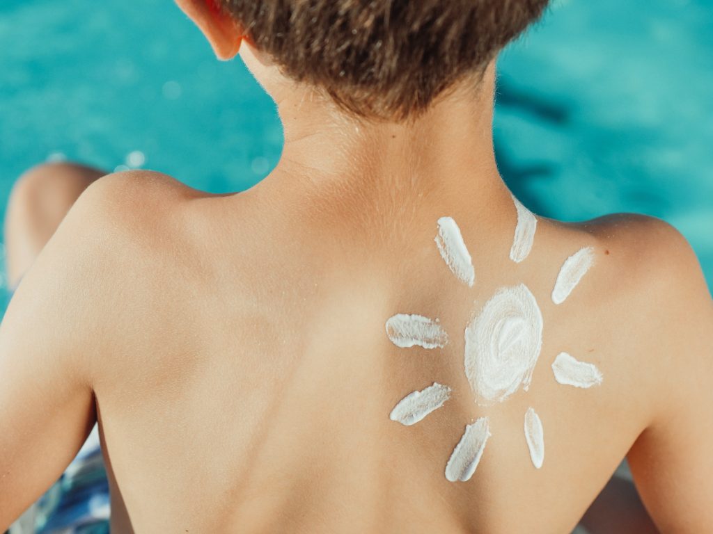Photo by Kindel Media: https://www.pexels.com/photo/sun-drawing-sunscreen-on-child-s-back-photo-8276909/